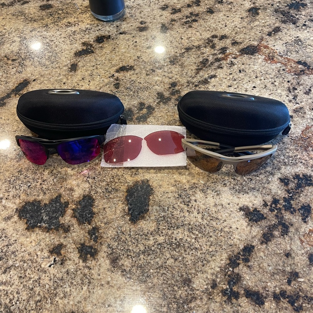2 pairs of Oakley Mercenary Golf Sunglasses.